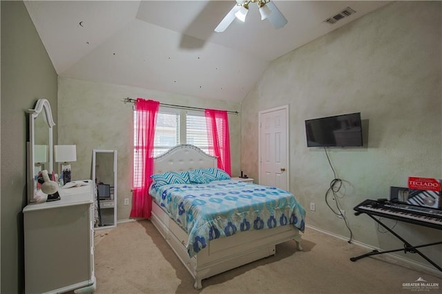 carpeted bedroom with vaulted ceiling and ceiling fan