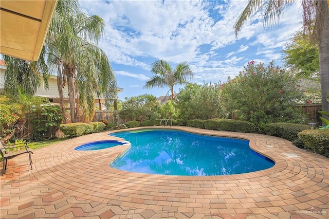 view of pool featuring an in ground hot tub and a patio area