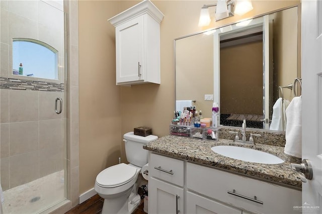 1408 May Dr, Edinburg, TX 78539 - full bath with toilet, a shower stall, vanity, and wood finished floors