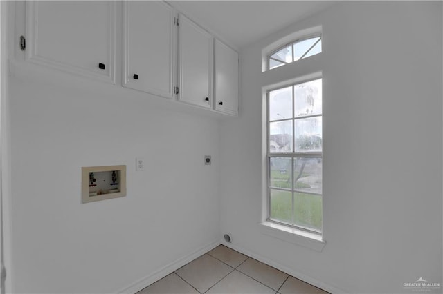 laundry room featuring washer hookup, light tile patterned floors, cabinets, and hookup for an electric dryer