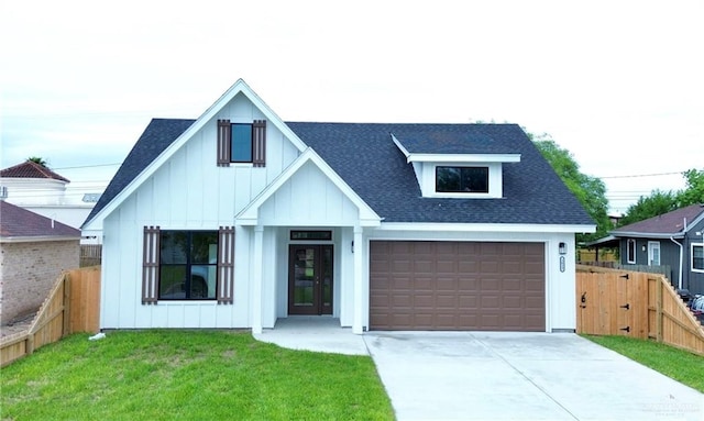 modern inspired farmhouse with a front lawn