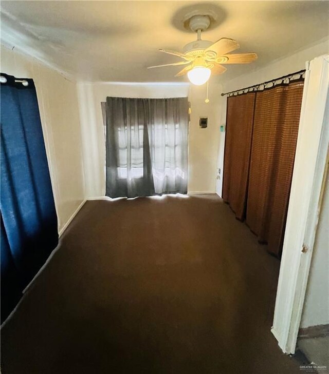 593 5th St, Raymondville, TX 78580 - unfurnished bedroom with carpet, ceiling fan, and baseboards