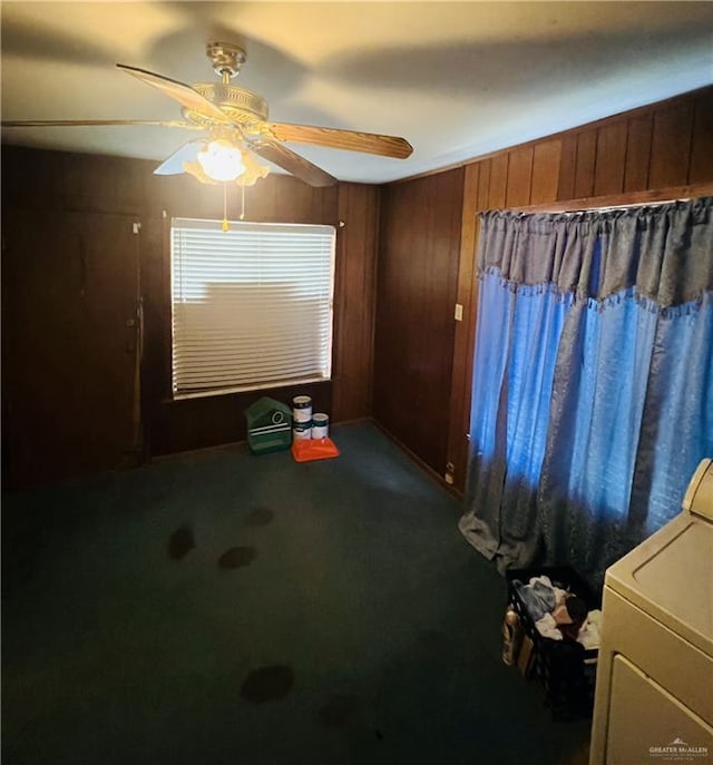 593 5th St, Raymondville, TX 78580 - unfurnished room featuring washer / clothes dryer, wood walls, carpet, and ceiling fan