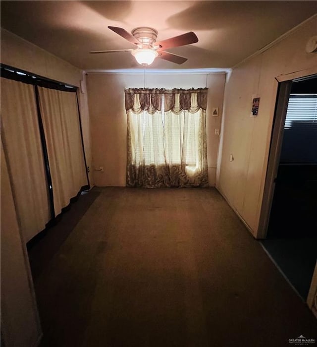 593 5th St, Raymondville, TX 78580 - unfurnished living room featuring ceiling fan, carpet floors, and ornamental molding