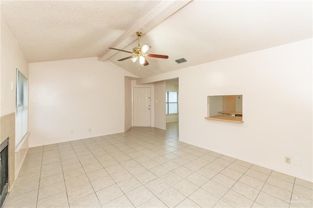 5111 Other, San Antonio, TX 78217 - spare room with a ceiling fan, a tiled fireplace, light tile patterned flooring, and a textured ceiling