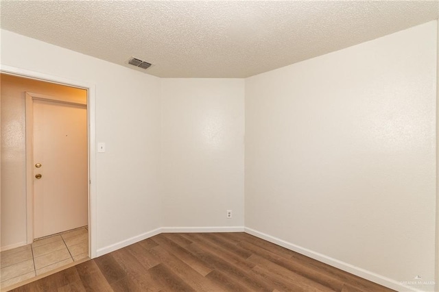 5111 Other, San Antonio, TX 78217 - empty room with wood finished floors, a textured ceiling, and baseboards