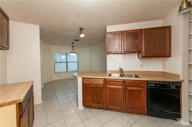 5111 Other, San Antonio, TX 78217 - kitchen featuring black dishwasher, a sink, tasteful backsplash, light countertops, and light tile patterned floors
