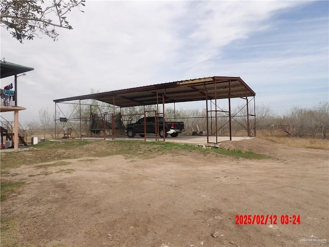 view of parking with a carport