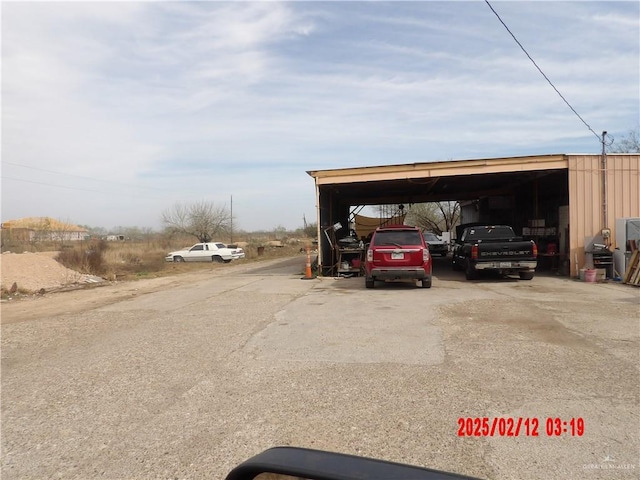 view of parking with a carport