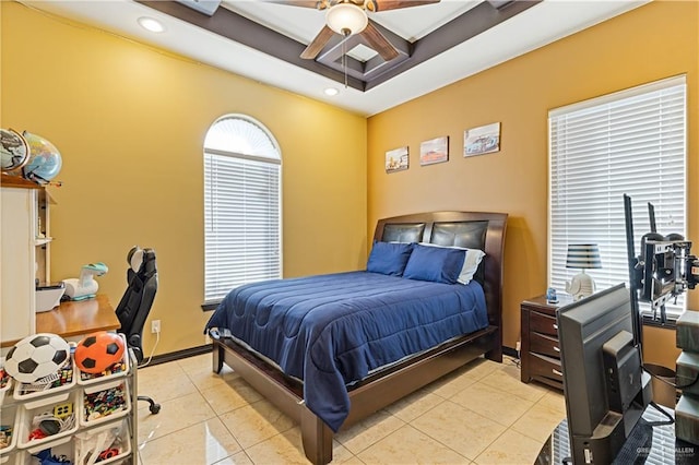 tiled bedroom featuring ceiling fan