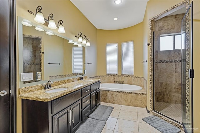 bathroom featuring tile patterned flooring, vanity, and separate shower and tub