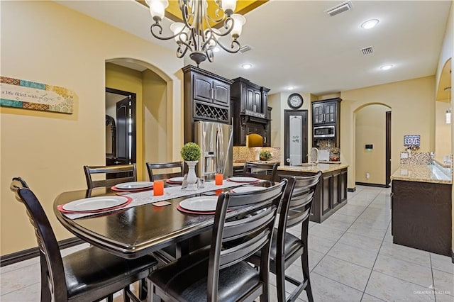 dining room featuring light tile patterned flooring and sink