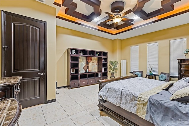 tiled bedroom with ceiling fan and coffered ceiling