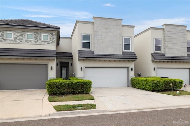 townhome / multi-family property featuring a garage