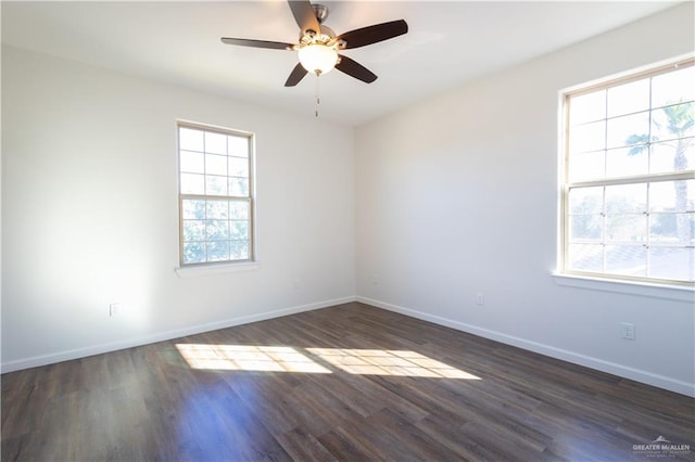 empty room featuring ceiling fan and dark hardwood / wood-style floors