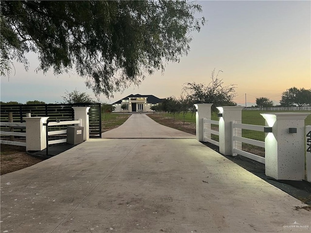 view of gate at dusk