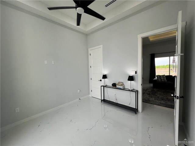 bathroom featuring a shower with door and toilet