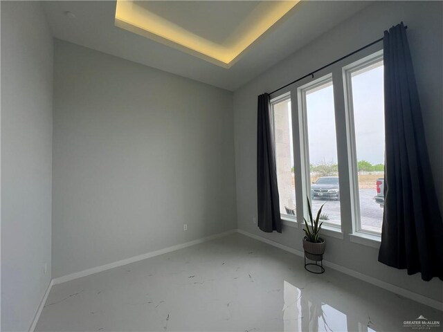 dining room featuring a tray ceiling