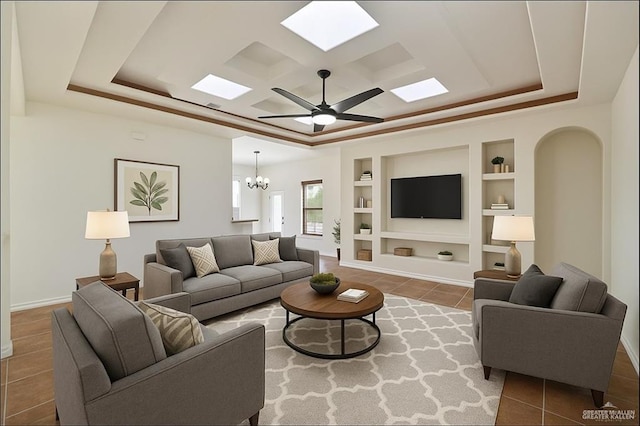 406 Casiano St, Donna, TX 78537 - tiled living area with built in shelves, a raised ceiling, and a chandelier