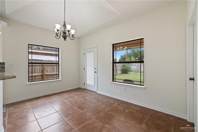 406 Casiano St, Donna, TX 78537 - unfurnished dining area featuring a chandelier, tile patterned flooring, and baseboards