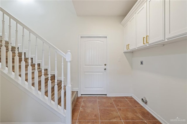 406 Casiano St, Donna, TX 78537 - laundry room with hookup for an electric dryer, cabinet space, baseboards, and tile patterned flooring