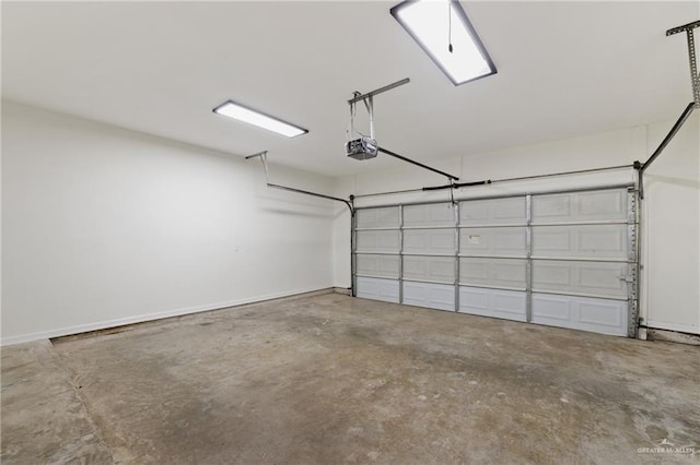 406 Casiano St, Donna, TX 78537 - garage featuring a garage door opener and baseboards