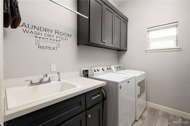 1801 Ozark Ave, Mcallen, TX 78504 - laundry room featuring washer and clothes dryer, cabinet space, and baseboards