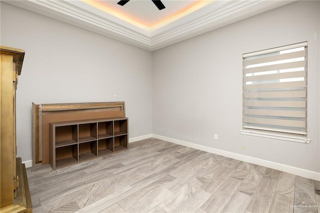 1801 Ozark Ave, Mcallen, TX 78504 - unfurnished room with a tray ceiling, wood finished floors, a ceiling fan, and baseboards