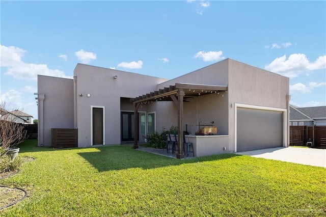 1801 Ozark Ave, Mcallen, TX 78504 - rear view of property featuring a garage, concrete driveway, and stucco siding