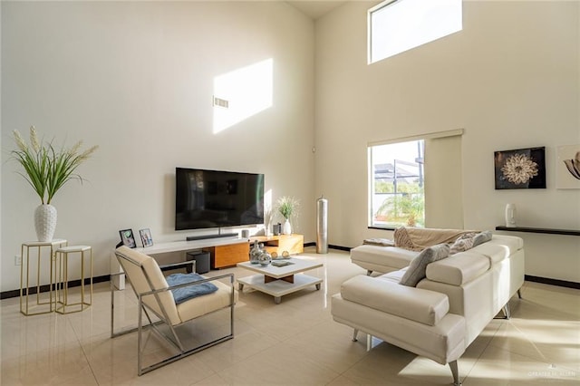 tiled living room featuring a high ceiling