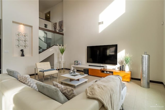 living room with a towering ceiling