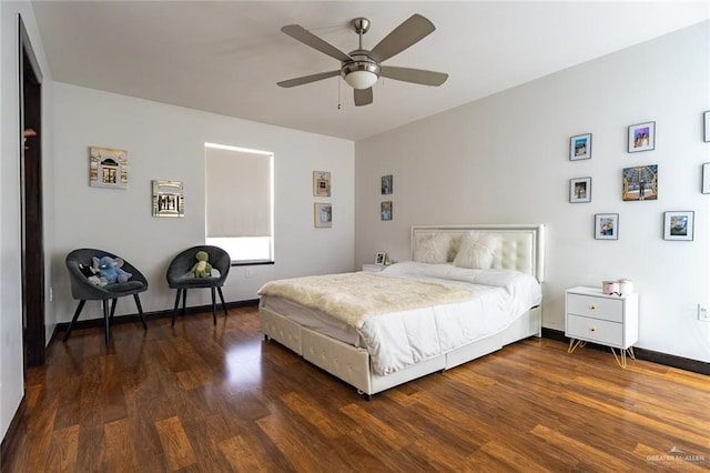 bedroom with dark hardwood / wood-style floors and ceiling fan