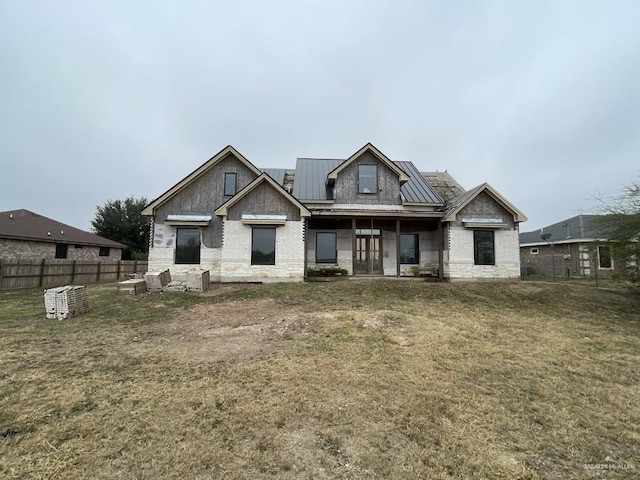 craftsman-style house featuring a front yard