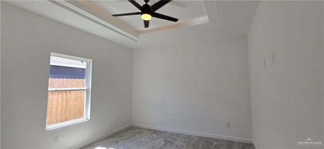 3808 Revilla St, Edinburg, TX 78542 - spare room with baseboards, a tray ceiling, and ceiling fan