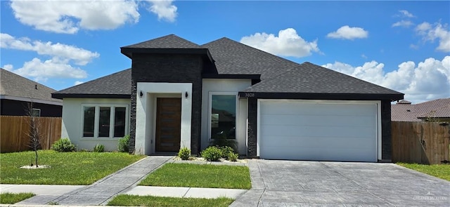 3808 Revilla St, Edinburg, TX 78542 - view of front facade with stucco siding, an attached garage, fence, and roof with shingles