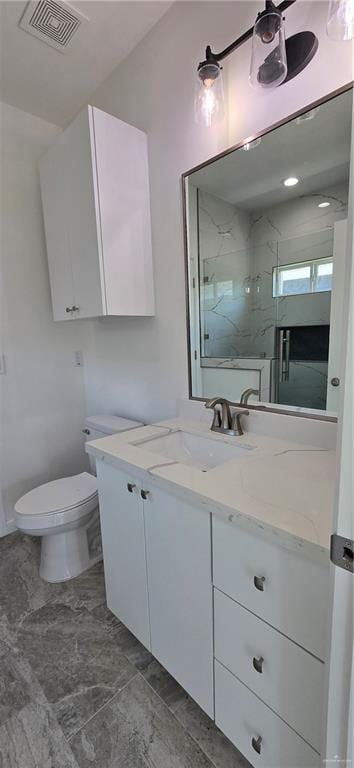 3808 Revilla St, Edinburg, TX 78542 - bathroom featuring visible vents, toilet, vanity, and a marble finish shower