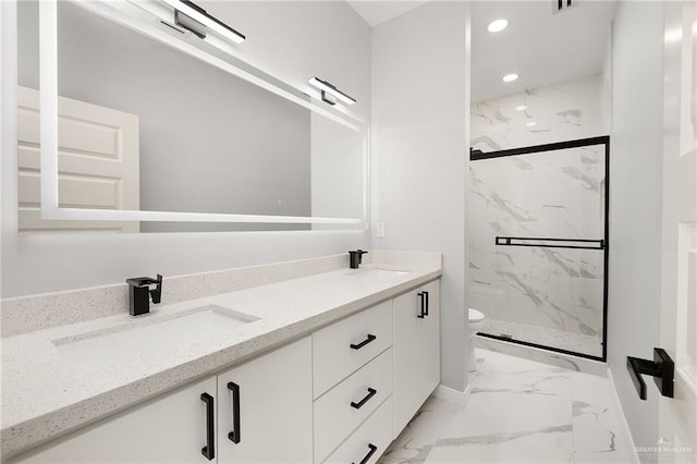 bathroom with vanity, toilet, and walk in shower