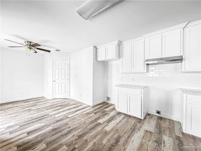 interior space with light hardwood / wood-style flooring and ceiling fan