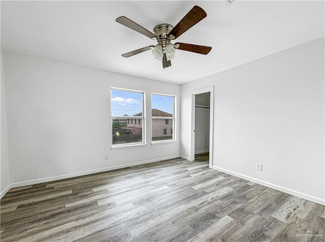 unfurnished bedroom featuring ceiling fan and light hardwood / wood-style flooring