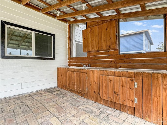 kitchen featuring wood walls