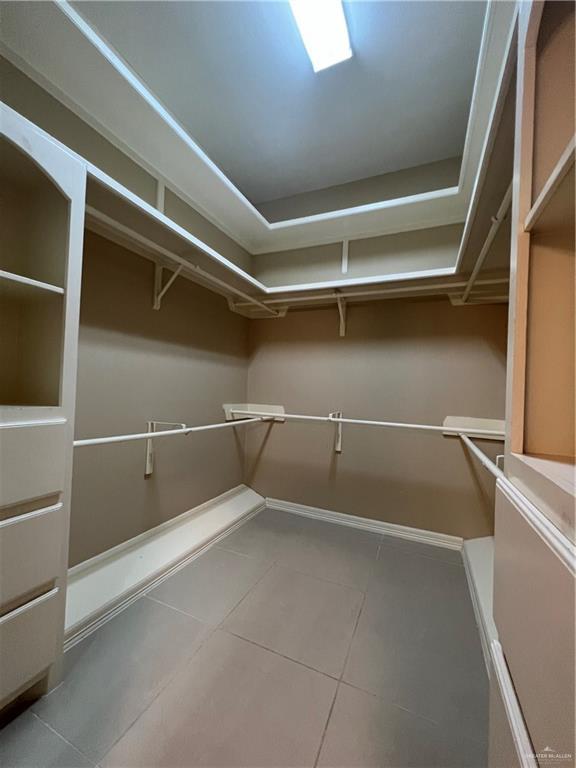 spacious closet featuring tile patterned floors