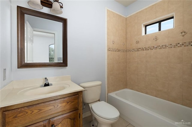 full bathroom featuring toilet, vanity, tile patterned flooring, and tiled shower / bath combo