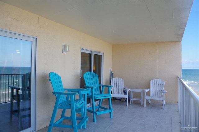 balcony featuring a water view