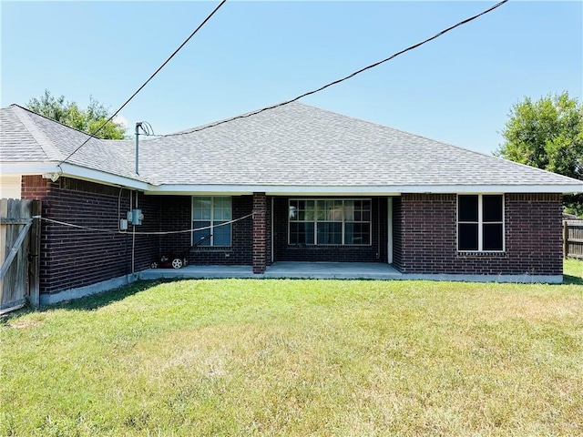 rear view of house with a lawn