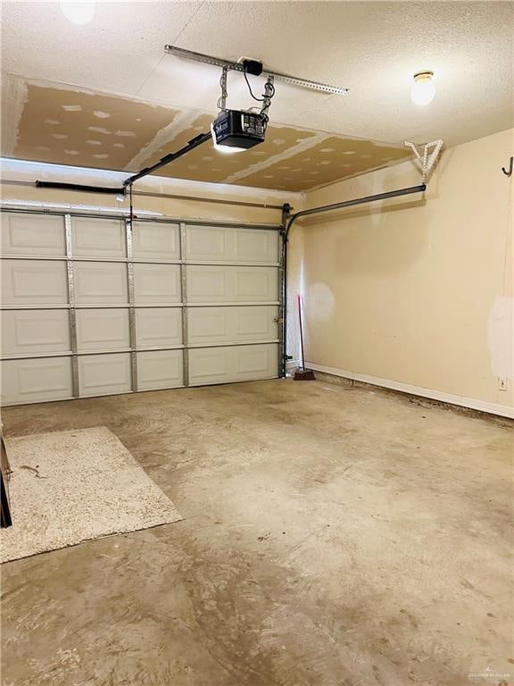 garage featuring a garage door opener