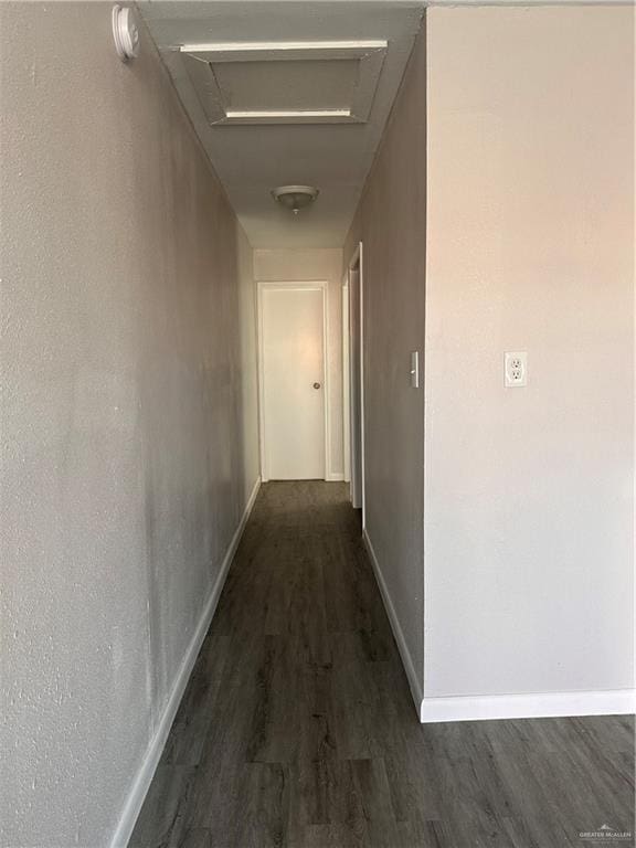 corridor featuring dark hardwood / wood-style floors