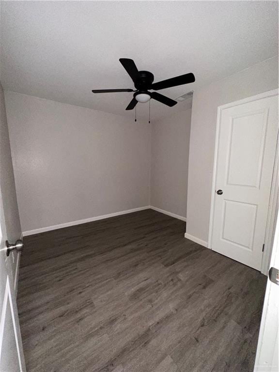 spare room featuring a textured ceiling, ceiling fan, and dark hardwood / wood-style floors