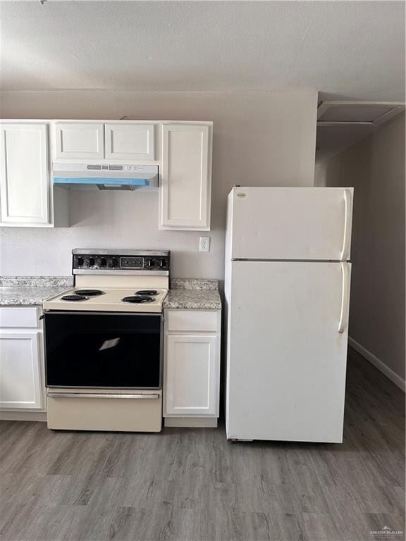 kitchen featuring white cabinets, white appliances, and light hardwood / wood-style flooring