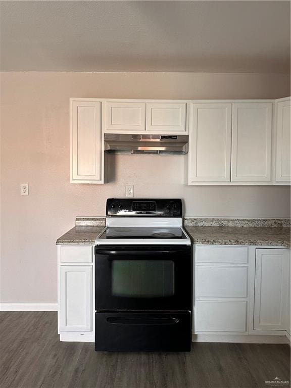 kitchen featuring white cabinets, dark wood-type flooring, black range with electric cooktop, and dark stone counters