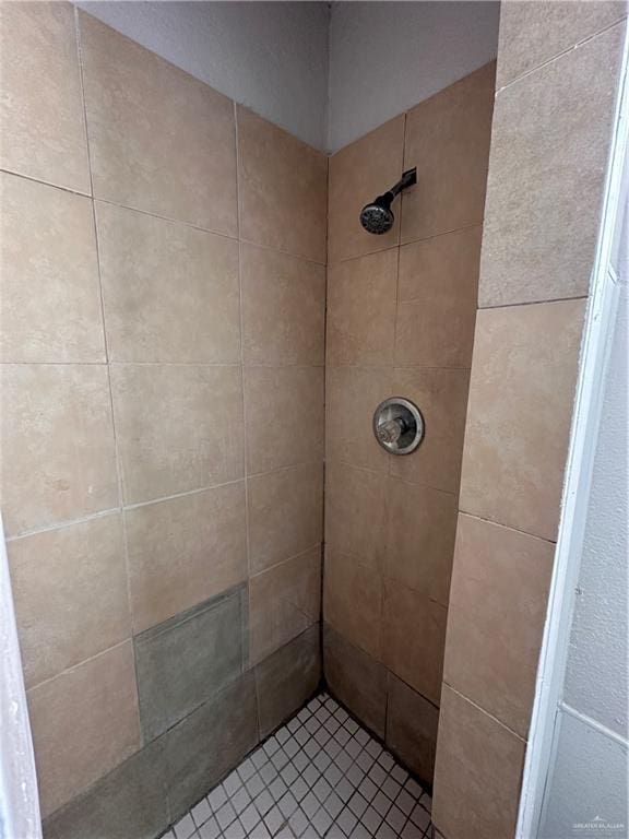 bathroom with tiled shower